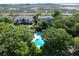 Aerial view of community pool, homes, and marshland at 1712 Live Oak Park, Seabrook Island, SC 29455