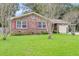 Lovely brick home featuring a large yard and red shutters at 104 Vanburen Ave, Ladson, SC 29456