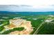 Aerial view of new homes, undeveloped land, and nearby railway at 285 Blue Haw Dr, Moncks Corner, SC 29461