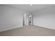 A bedroom with neutral carpet featuring doorways to a closet and bathroom at 285 Blue Haw Dr, Moncks Corner, SC 29461