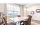 Dining room with a table and chairs near a window and entryway at 285 Blue Haw Dr, Moncks Corner, SC 29461