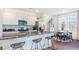 Open kitchen features an island with seating, stainless steel appliances, and a breakfast nook at 285 Blue Haw Dr, Moncks Corner, SC 29461