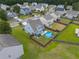 Aerial view showcases home, fenced yard, and above ground pool in the neighborhood at 575 Rosings Dr, Summerville, SC 29486