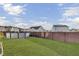 Expansive backyard features lush green grass, an above ground pool, and privacy fence at 575 Rosings Dr, Summerville, SC 29486