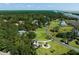 Aerial view of a neighborhood surrounded by trees and waterways at 7848 Pelican Bay Dr, Awendaw, SC 29429