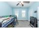 Bright bedroom with a bunk bed, carpet floors, and a ceiling fan at 208 Sweetspire Ln, Summerville, SC 29483