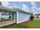 Exterior view of covered parking and back door with green grass at 208 Sweetspire Ln, Summerville, SC 29483