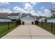 Close view of the garage and a concrete driveway at 208 Sweetspire Ln, Summerville, SC 29483
