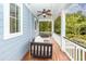 Relaxing covered porch with a swing and ceiling fan at 208 Sweetspire Ln, Summerville, SC 29483