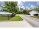 View of the street, neighboring houses, and fenced yards at 208 Sweetspire Ln, Summerville, SC 29483