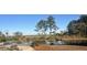 Serene pond with wooden benches and a fountain, beautiful view at 803 Lachicotte Creek Dr, Charleston, SC 29492