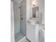 Updated bathroom features a walk-in shower with gray tile and a modern white vanity at 1466 Glencoe St, Mount Pleasant, SC 29464