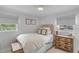 Cozy bedroom with a wooden dresser, window blinds, and neutral color scheme at 1466 Glencoe St, Mount Pleasant, SC 29464
