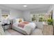 Light and airy bedroom with a comfortable bed and window seat at 1466 Glencoe St, Mount Pleasant, SC 29464