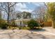 Landscaped front yard with driveway and white brick house at 1466 Glencoe St, Mount Pleasant, SC 29464