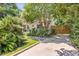 Landscaped front yard with brick driveway and lush greenery at 1466 Glencoe St, Mount Pleasant, SC 29464