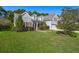 Gray two-story house with red shutters, a large front yard, and a two-car garage at 399 Decatur Dr, Summerville, SC 29486