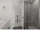 Bathroom features a shower with glass doors, hexagon tile floor, and access to the bonus room at 506 Fiskdale Cir, Summerville, SC 29486