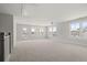 Bright bonus room with many windows, a ceiling fan, and neutral carpet at 506 Fiskdale Cir, Summerville, SC 29486