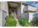 Inviting condo entrance with a stairway, lush landscaping, reserved parking, and a charming, bright, and clean exterior at 607 Waterwood Dr, Goose Creek, SC 29445