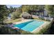 Community pool surrounded by a fence and lush greenery, perfect for relaxing and enjoying the outdoors at 607 Waterwood Dr, Goose Creek, SC 29445