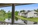 A serene water view of this condo complex reflecting the surrounding trees and building in the still water of the pond at 607 Waterwood Dr, Goose Creek, SC 29445