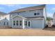 Exterior view of the house with a patio, showcasing its architectural design and outdoor living space at 107 Grange Cir, Summerville, SC 29486