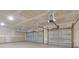 Large open garage with two overhead doors, ample space for vehicles and storage at 107 Grange Cir, Summerville, SC 29486