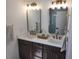 Double vanity with dark cabinets and bronze fixtures in bathroom at 22 Iron Forge Aly, Charleston, SC 29403