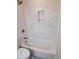 Clean bathroom featuring a tub with white subway tiles and brass fixtures at 22 Iron Forge Aly, Charleston, SC 29403