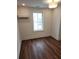 Cozy bedroom with a window, hardwood floors and mini split at 22 Iron Forge Aly, Charleston, SC 29403