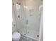 Modern shower with glass door, subway tile, and gold hardware at 22 Iron Forge Aly, Charleston, SC 29403