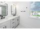 A bathroom that features double sinks, modern fixtures, and tile floor at 24 Iron Frg Aly, Charleston, SC 29403