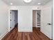 Bedroom with hardwood floors, recessed lighting and white trim, with views of stairs and a closet through open doors at 24 Iron Frg Aly, Charleston, SC 29403