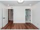 A bright bedroom with hardwood floors, a ceiling fan, recessed lights, and neutral white walls at 24 Iron Frg Aly, Charleston, SC 29403