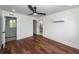 A bright bedroom with hardwood floors, a ceiling fan, recessed lights, and neutral white walls at 24 Iron Frg Aly, Charleston, SC 29403