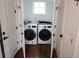 Bright laundry room features side-by-side washer and dryer at 24 Iron Frg Aly, Charleston, SC 29403