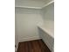 A bright, spacious walk-in closet with hardwood floors, shelf storage, and room to hang clothes at 24 Iron Frg Aly, Charleston, SC 29403