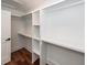 Spacious walk-in closet with custom white shelving and storage, providing ample space at 24 Iron Frg Aly, Charleston, SC 29403