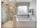 Beautiful bathroom featuring glass shower and separate soaking tub with tiled accents at 113 O'Leary Circle, Summerville, SC 29483