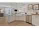 Bright kitchen features a large island with a farmhouse sink and stainless steel appliances at 113 O'Leary Circle, Summerville, SC 29483