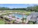 Inviting community pool with lounge chairs, palm trees, and picturesque lake views at 113 O'Leary Circle, Summerville, SC 29483