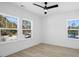 Bright bedroom with wood-look floors and multiple windows at 2213 Sally Gaillard Ln, Mount Pleasant, SC 29466