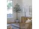 Bright living room featuring hardwood floors, large windows, and stylish decor, creating a light and airy space at 517 Royall Ave, Mount Pleasant, SC 29464