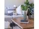 Tastefully decorated living room with comfortable seating, indoor plants, and a rustic coffee table, creating a cozy ambiance at 517 Royall Ave, Mount Pleasant, SC 29464