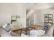 Inviting living room features hardwood floors, neutral walls, and stylish furniture, creating a warm and welcoming atmosphere at 517 Royall Ave, Mount Pleasant, SC 29464
