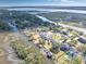 Picturesque aerial view of waterfront homes with private docks along a scenic river and marshland, perfect for boating at 1894 Capri Dr, Charleston, SC 29407