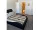 Bedroom showcasing stylish bed, a glimpse into the bathroom, and neutral tones for a relaxing atmosphere at 2150 Spoleto Ln # B-6, North Charleston, SC 29406
