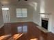 Bright living room with hardwood floors, fireplace, and access to the front door at 170 Willowbend Ln, Summerville, SC 29485