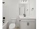 Modern bathroom with white cabinets, vanity, toilet, and shower and bath combo featuring dark hardware at 2833 Auldreeke Rd, Johns Island, SC 29455